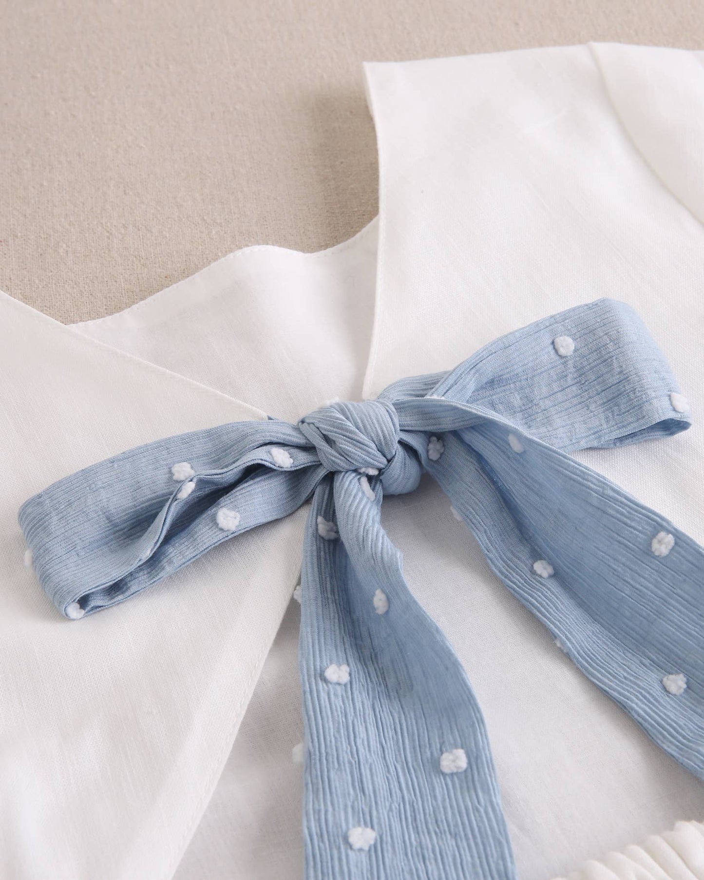Dadati - Girl's long jumpsuit with back opening and blue bow