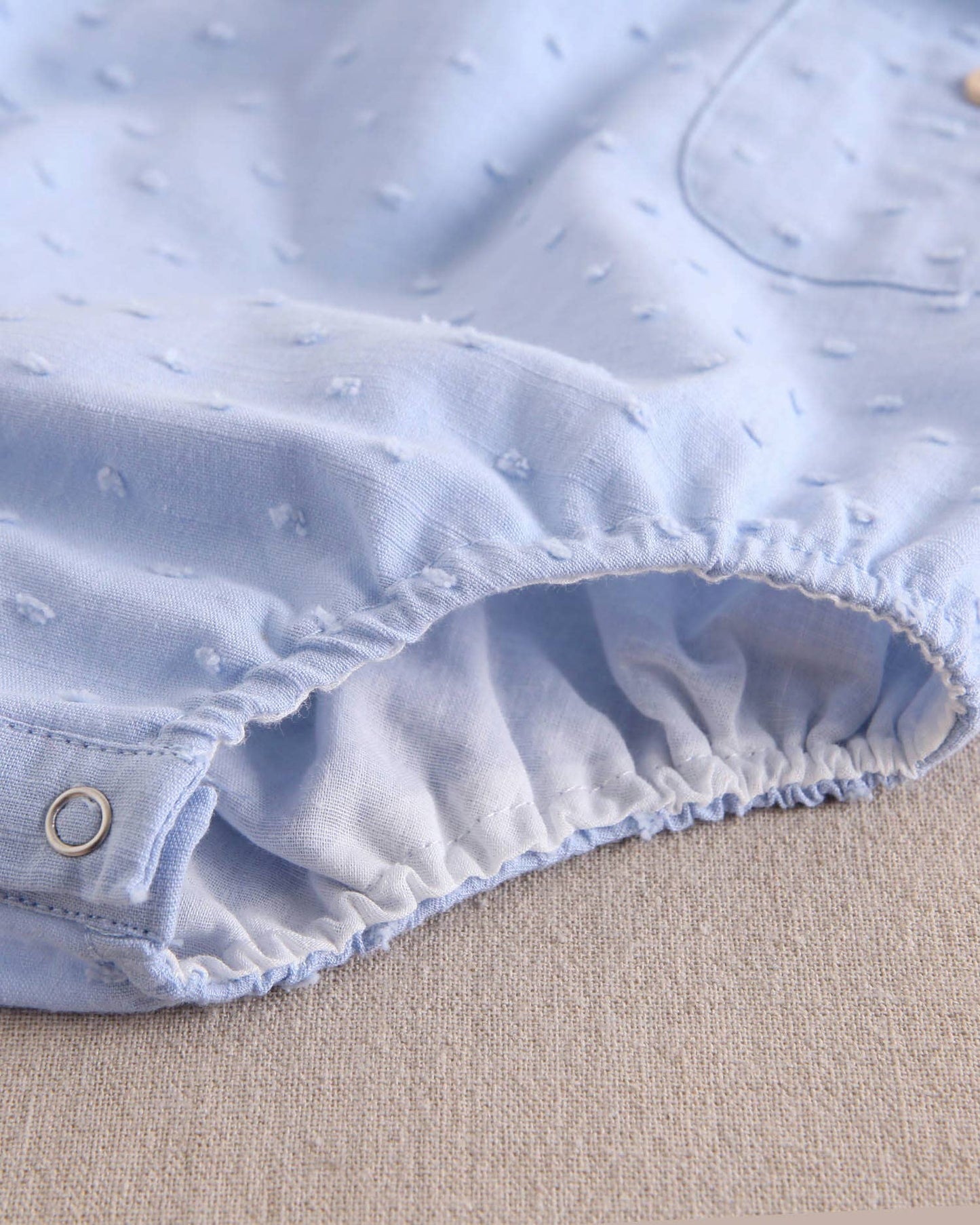 Dadati - Baby boy blue plumeti romper with crossed straps