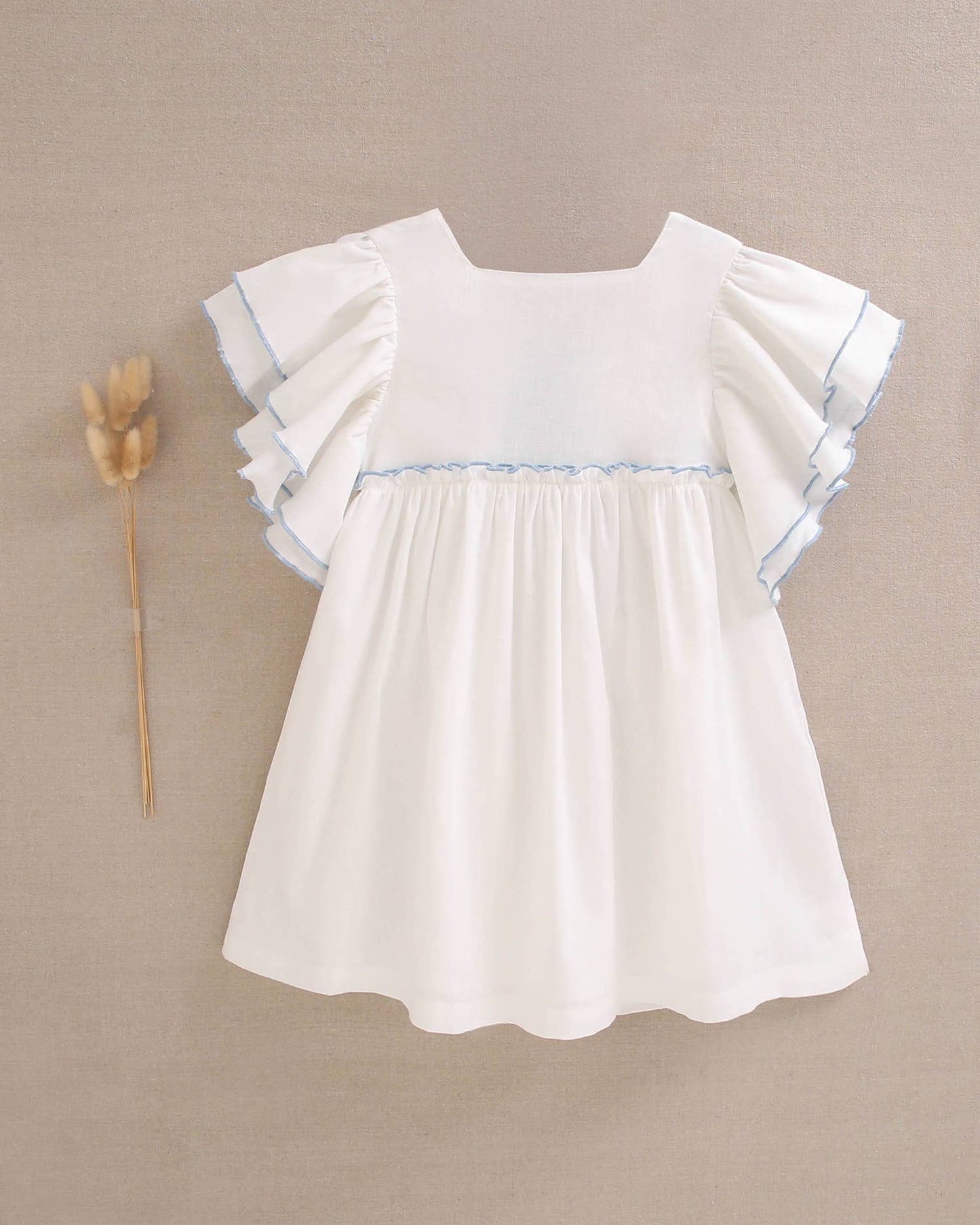 Dadati - White girl's dress with blue edges and a bow on the back
