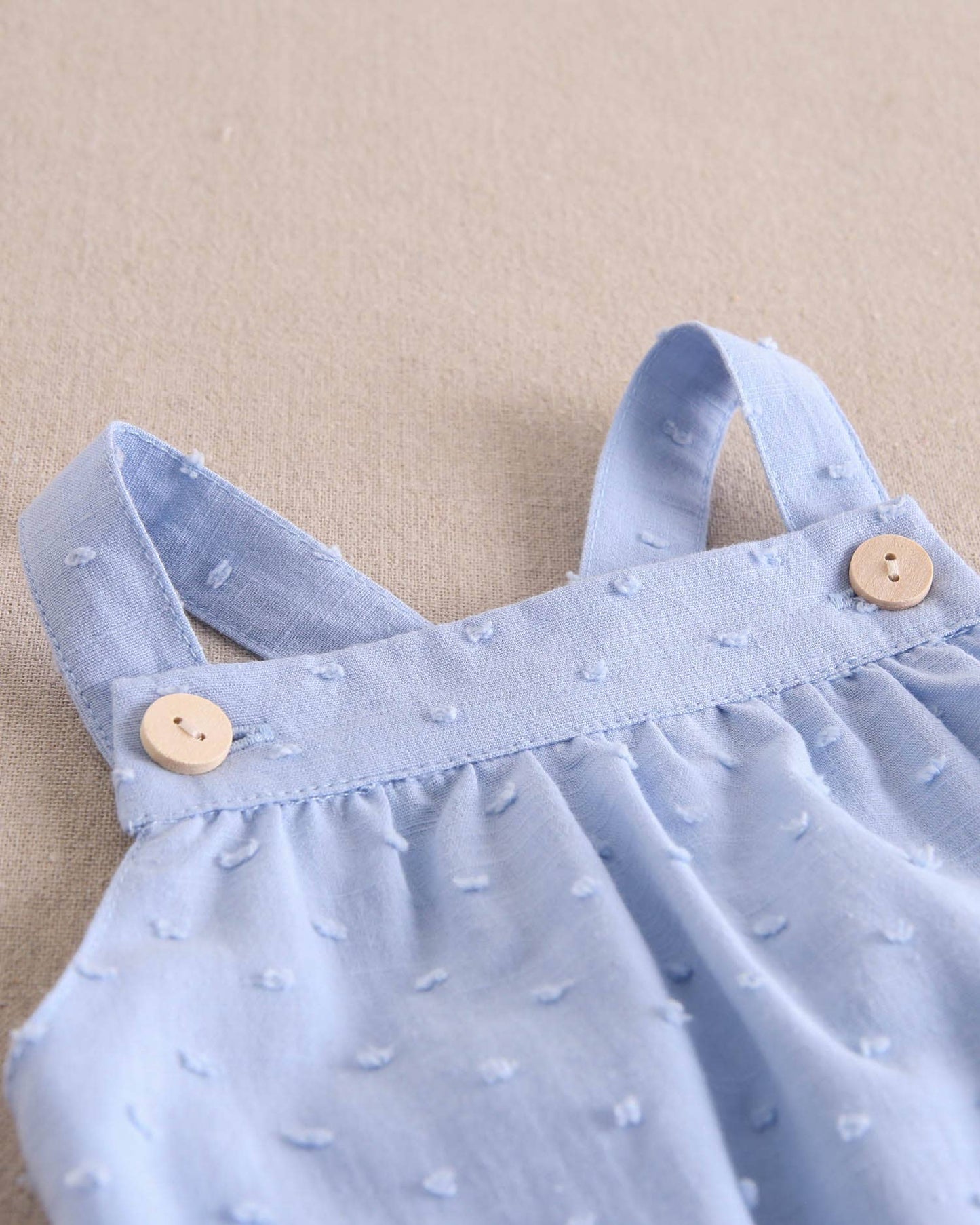 Dadati - Baby boy blue plumeti romper with crossed straps