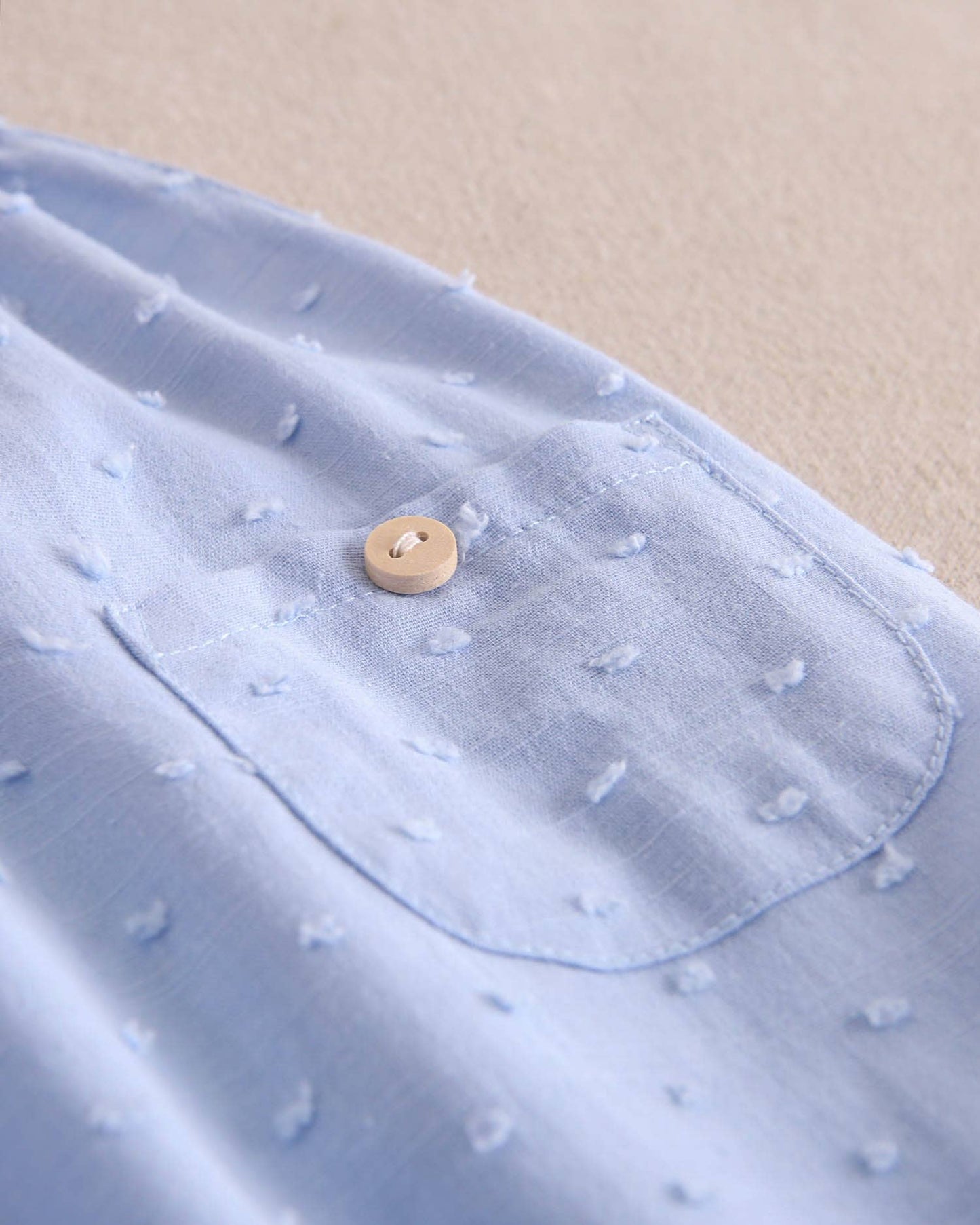 Dadati - Baby boy blue plumeti romper with crossed straps