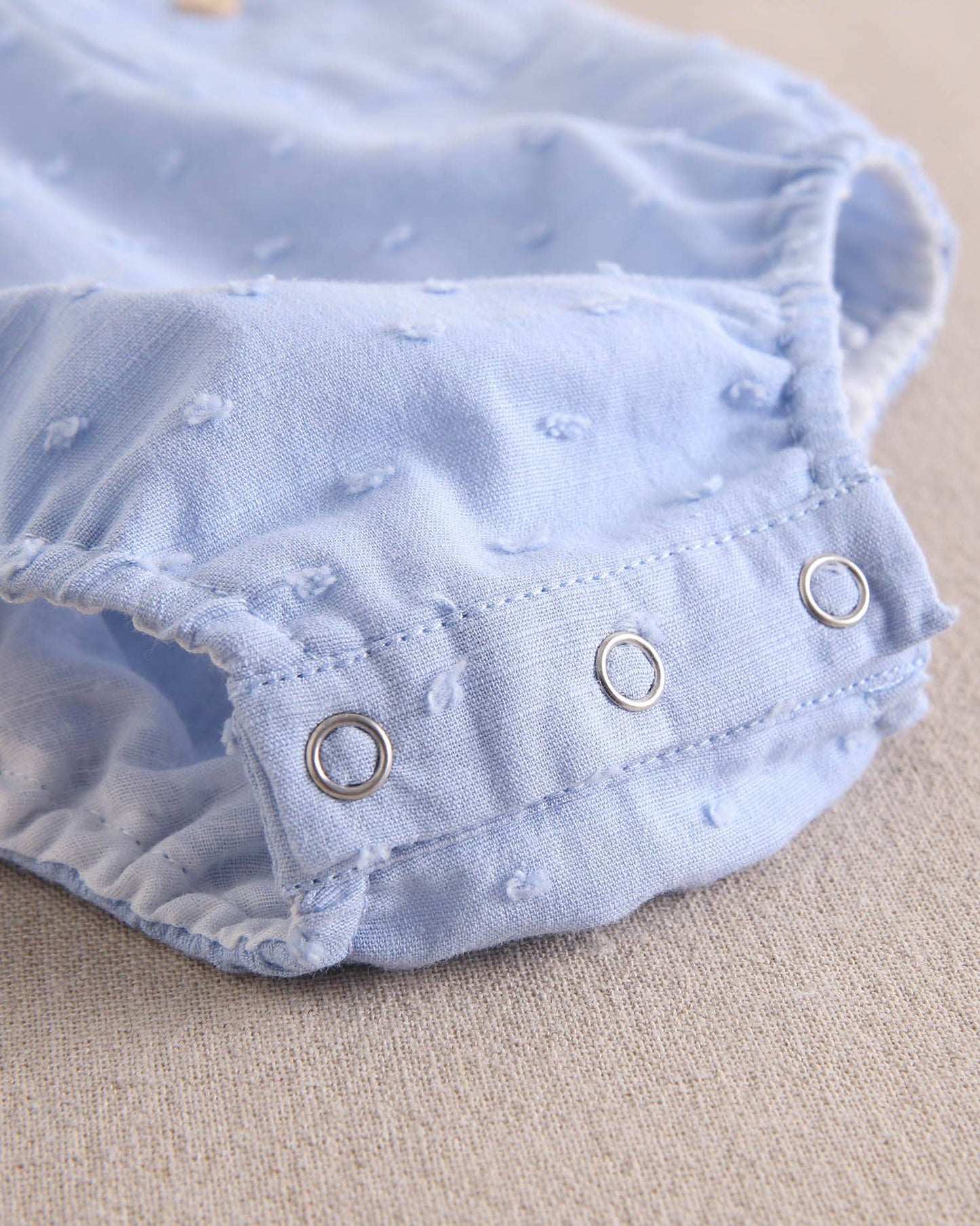 Dadati - Baby boy blue plumeti romper with crossed straps