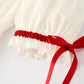 Rylee Faith Designs - White Christmas Girl's Dress: Delicate Embroidery with Red Bow Details