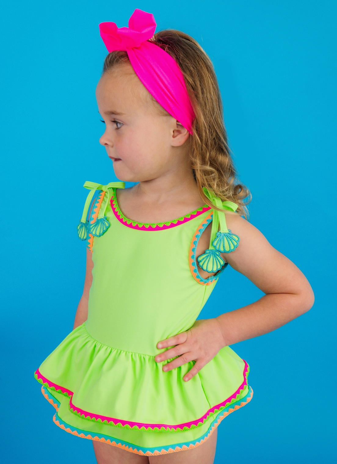 RuffleButts – Girls Neon Honeydew Crochet Detail Peplum One-Piece Swimsuit