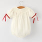 Rylee Faith Designs - Christmas Girl's Romper : Delicate Embroidery with Red Bow Details